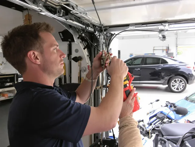 Rocky River Garage Door Repair safety certified technician performing cable replacement in Rocky River