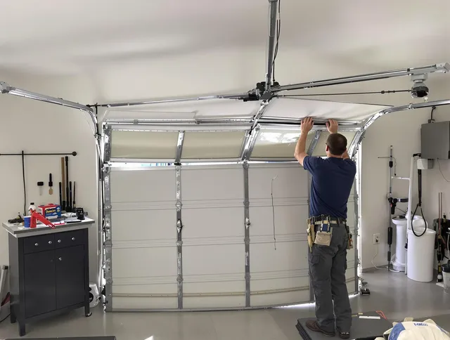 Rocky River Garage Door Repair specialist performing precise section replacement on Rocky River garage door